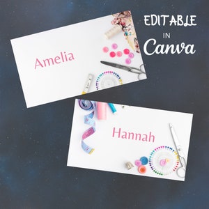 May include: Two white cards with pink text, "Amelia" and "Hannah", surrounded by sewing supplies like buttons, thread, measuring tape, and pins. The text "Editable in Canva" is in the top right corner.