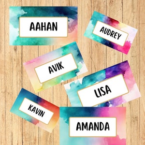 May include: Six watercolor name tags with gold trim. The names are Aahan, Audrey, Avik, Lisa, Kavin, and Amanda.