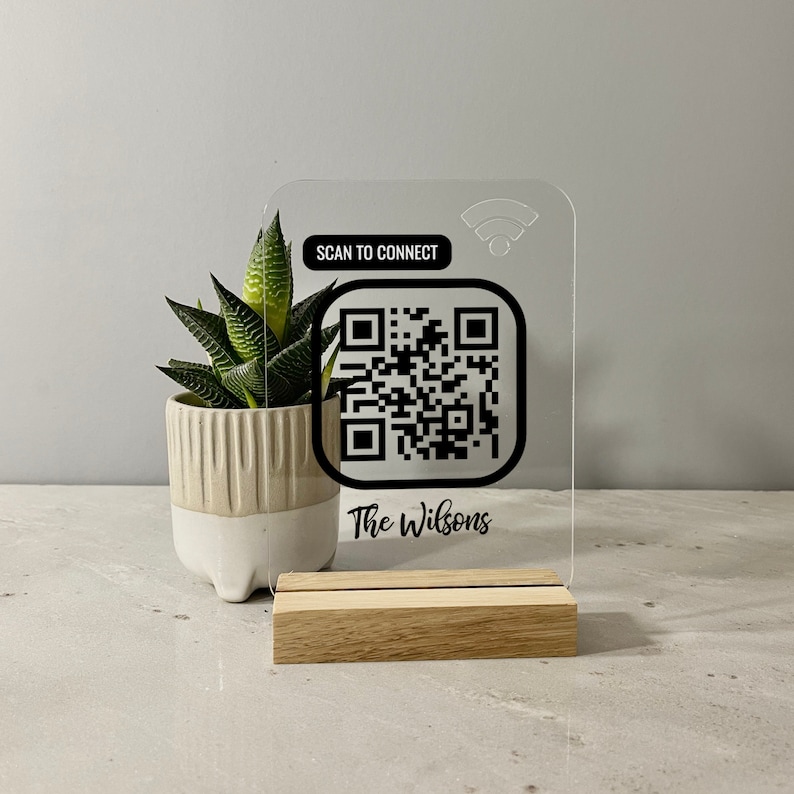 Personalised QR WiFi sign made in clear acrylic. Just scan the QR code and will automatically connect to your wifi. A personalised message can be printed at the bottom for no extra charge