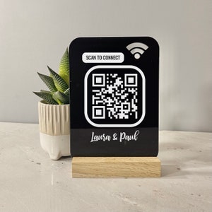 Personalised QR WiFi sign made in black acrylic. Just scan the QR code and will automatically connect to your wifi. A personalised message can be printed at the bottom for no extra charge