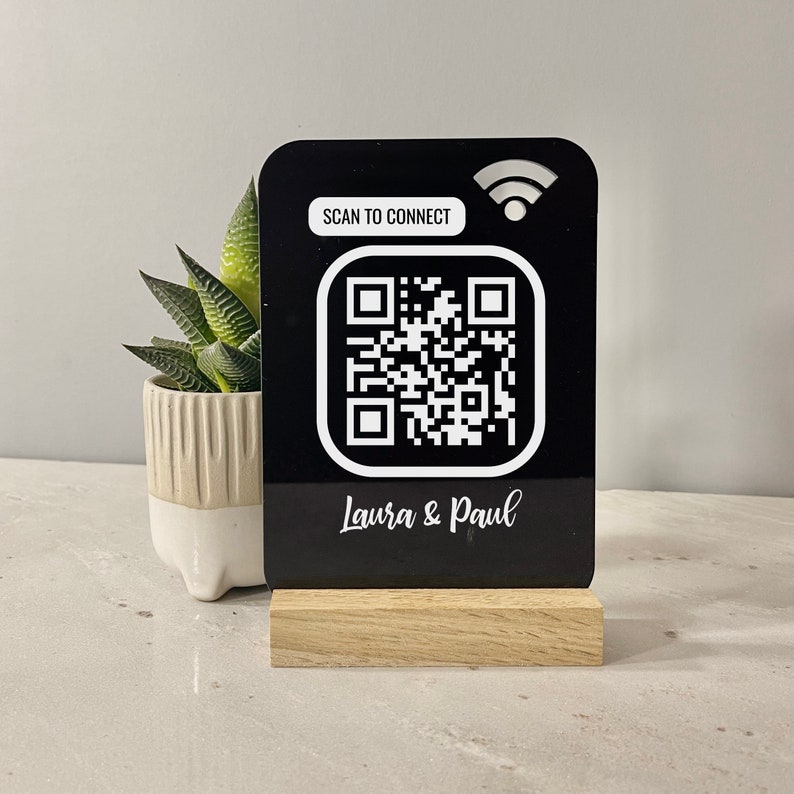 Personalised QR WiFi sign made in black acrylic. Just scan the QR code and will automatically connect to your wifi. A personalised message can be printed at the bottom for no extra charge