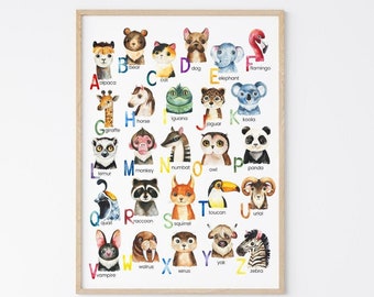 May include: A colorful alphabet chart featuring animals. Each letter of the alphabet is paired with an animal illustration and the animal's name. The chart is framed in a light wood frame and is hanging on a white wall.