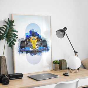 May include: A framed watercolor print of a Formula 1 race car in blue, yellow, and black. The car is surrounded by a blue and white watercolor background.