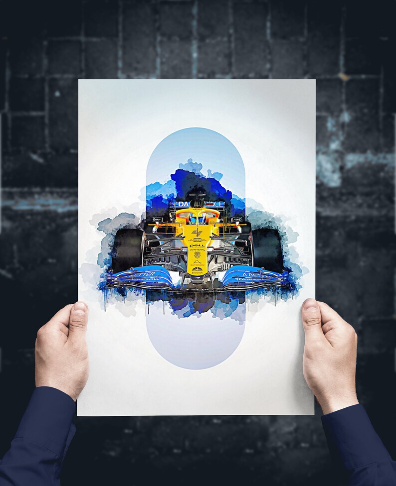 May include: A watercolor painting of a Formula 1 race car in blue, yellow, and black with the word "DAZN" on the side. The car is surrounded by blue and white watercolor splatters.