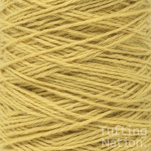 May include: A close-up of a spool of yellow yarn. The yarn is tightly wound and has a soft, fuzzy texture.