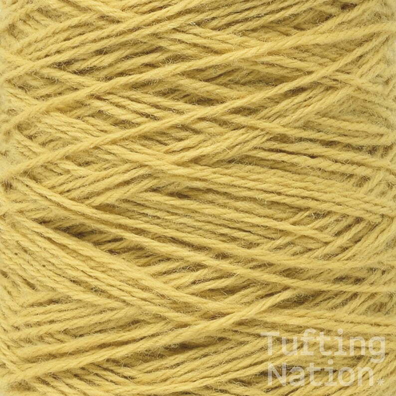 May include: A close-up of a spool of yellow yarn. The yarn is tightly wound and has a soft, fuzzy texture.