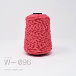 May include: A spool of bright pink yarn, labeled "Color no. W-096".