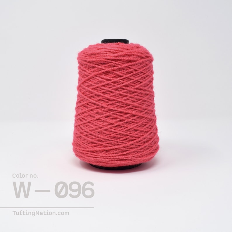 May include: A spool of bright pink yarn, labeled "Color no. W-096".