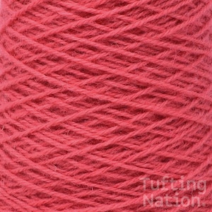 May include: A close-up of a spool of bright red yarn. The yarn is tightly wound and has a soft, fuzzy texture.