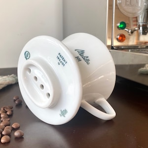 Very Rare Suisse Melitta 101 Langenthal, Swiss, 4 hole Coffee Filter, 1955, with Swiss Patent 196601 and SIH stamp. In immaculate condition.