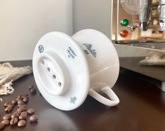 Very Rare Suisse Melitta 101 Langenthal, Swiss, 4 hole Coffee Filter, 1955, with Swiss Patent 196601 and SIH stamp. In immaculate condition.