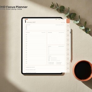 May include: A digital tablet displaying a 2027 ADHD Focus Planner with a daily schedule, task lists, and habit trackers. The screen shows the text 2027 ADHD Focus Planner, Top 3, Time blocks, Brain dump, Done, and January 2027.