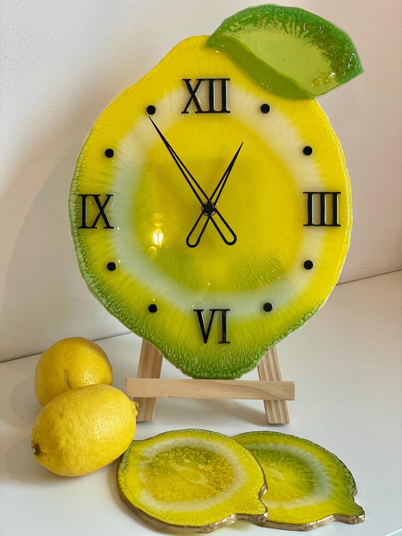 Lemon resin wall clock with black clock face and lemon coasters