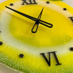 Lemon resin wall clock with black clock face