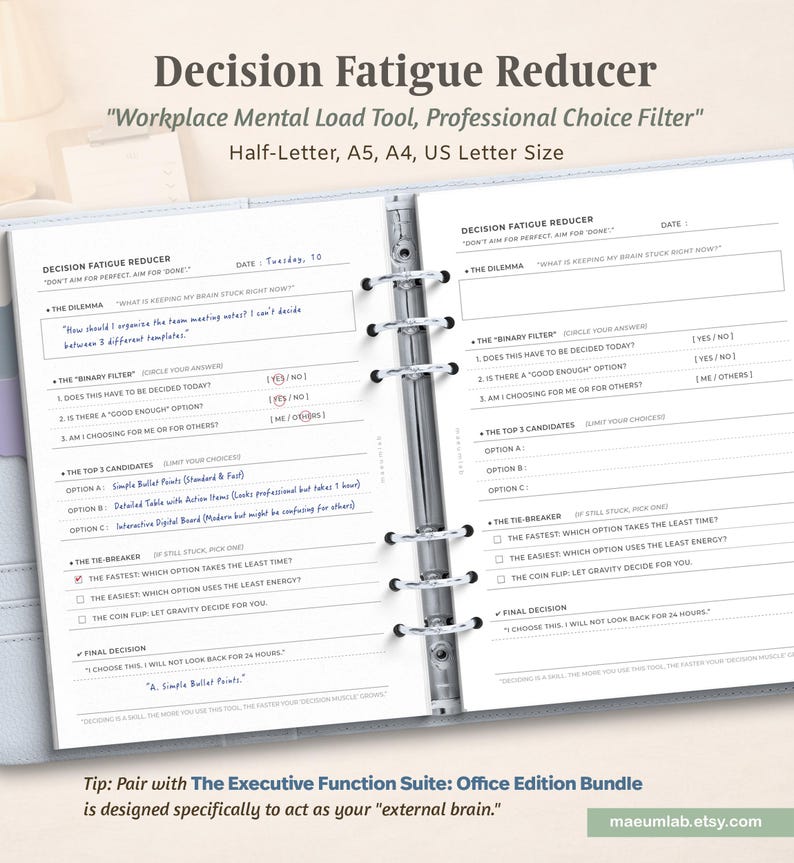 May include: A ring-bound planner open to a Decision Fatigue Reducer page. The form includes sections for The Dilemma, The Binary Filter, The Top 3 Candidates, The Tie-Breaker, and Final Decision. Text is printed in black on white paper.