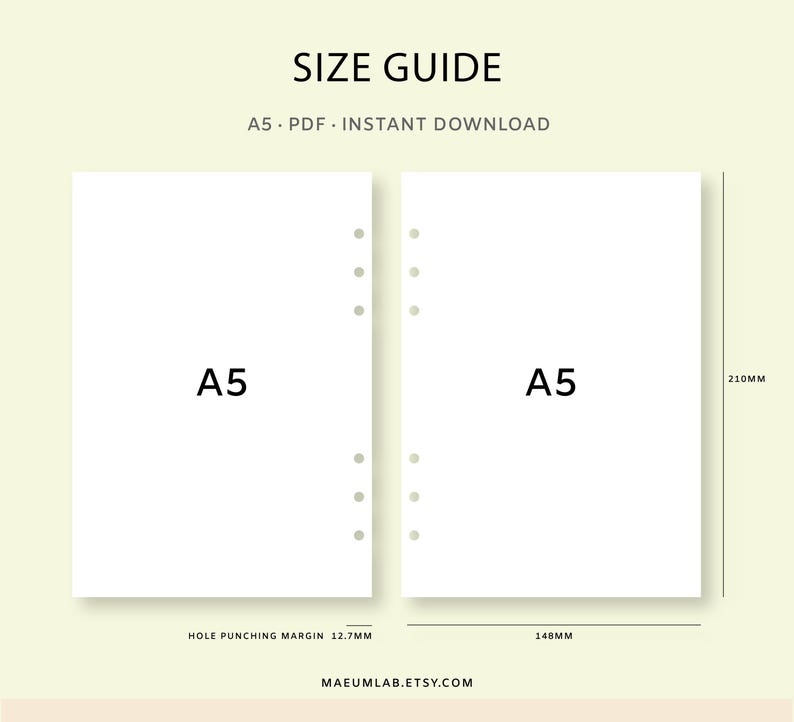 May include: Size guide for A5 PDF instant download. Two white A5 paper sheets with hole punches are displayed. The dimensions are 14.8cm wide, 21cm high, and a hole punching margin of 1.27cm. The text "SIZE GUIDE" is at the top.