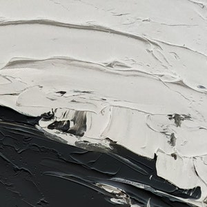 May include: Abstract painting with thick white paint strokes on a black background.
