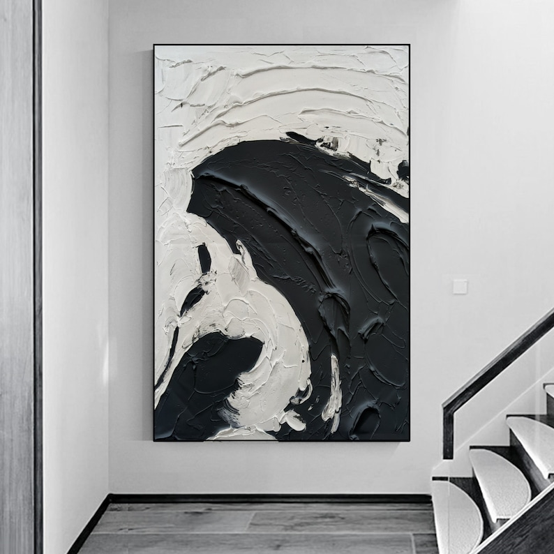 May include: Abstract painting with black and white paint strokes. The painting features a large, swirling black shape on a white background.