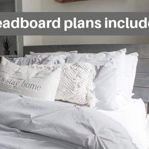 May include: A white bed with a gray headboard and white bedding. The headboard is made of wood planks and has a rustic look. The bedding is made of soft, white fabric and has a simple, elegant design. The pillows are white and have a variety of textures. The bed is decorated with a throw pillow that says "Let's stay home". The text "headboard plans included" is written in gray on a white background above the bed.