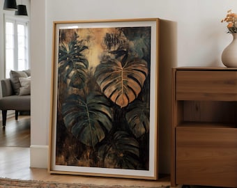 May include: Large framed artwork featuring a botanical illustration of monstera leaves. The leaves are depicted in shades of green and brown, with a golden hue on some. The artwork is displayed in a room with wooden furniture and a patterned rug.