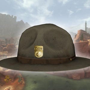 May include: A brown felt hat with a wide brim and a brown leather band. A gold-colored badge with the word "ZION" is affixed to the front of the hat. The hat is a classic style, suitable for outdoor activities.