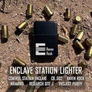May include: A black lighter with the text "Raven Rock" and a stylized "E" on the front. The lighter is surrounded by spent bullet casings on a dirt surface. The text "ENCLAVE STATION LIGHTER" is at the bottom of the image. The text "CONTROL STATION ENCLAVE CB_002 RAVEN ROCK NAVARRO RESEARCH SITE J PROJECT PURITY" is below the lighter.