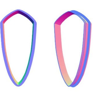 Könnte beinhalten: Drei übereinanderliegende Ausstecher in Form eines Schildes. Die Ausstecher sind rosa, blau und grün.