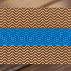 May include: Blue rolling pin with a wavy pattern. The rolling pin is on top of a brown surface with a wavy pattern.