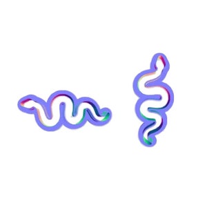 May include: Two purple, blue, and green snakes with a 3D effect. The snakes are curled in a wavy pattern.