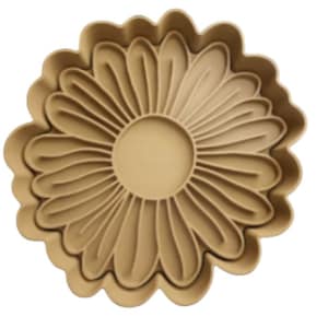 May include: A brown ceramic dish shaped like a daisy with a raised center and scalloped edges.
