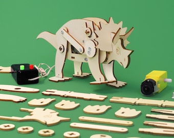 May include: A wooden toy dinosaur kit with a motor and a battery pack. The kit includes a triceratops dinosaur, a motor, and a variety of wooden pieces that can be assembled to create the dinosaur. The dinosaur is brown and has a green background.
