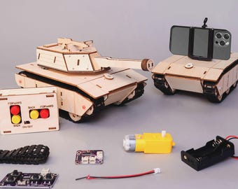 May include: Wooden model tank kit with a remote control, a phone holder, and various electronic components. The kit includes a tank with a long barrel, a remote control with red and yellow buttons, and a black battery holder.