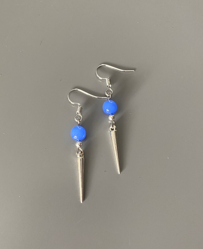 Blue stone and spike dangle earrings