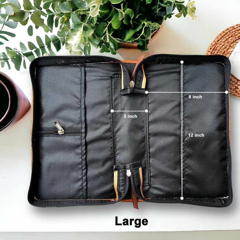 May include: Open brown leather Bible case with black lining and zippered pockets. The case measures 12 inches long, 8 inches wide, and 3 inches deep.  Large.