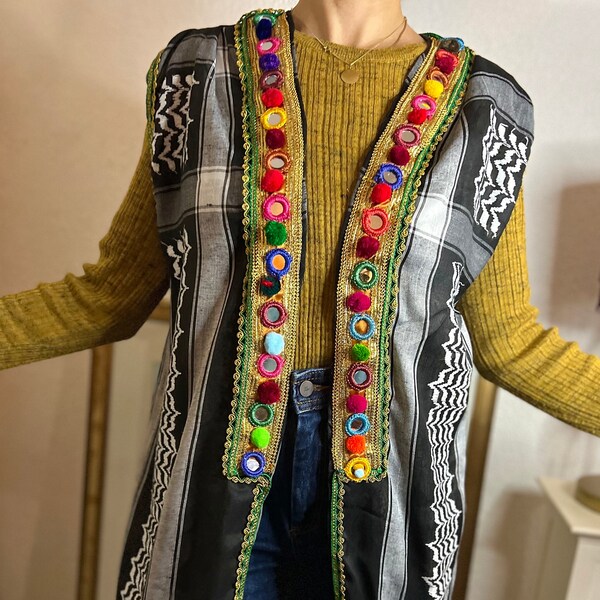 B/W Sleeveless waistcoat/abaya/jacket/waistcoat/robe/kimono/coat. Iraq-Arabic-Palestine keffiyeh/shemagh/kufiya; tassels, pompons, trims, ruffles