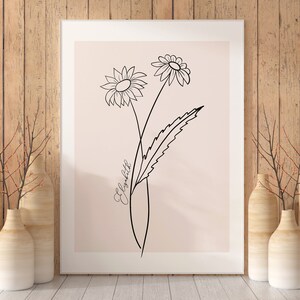May include: A white frame with a light pink background featuring a black line drawing of two stylized daisies with a single leaf. The text "Elizabeth" is written in cursive on the right side of the image.