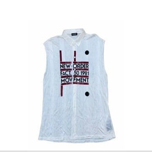 May include: White sleeveless shirt with a button-down collar. The shirt features the text "NEW ORDER FACT. 50 1981 MOVEMENT" in a maroon font. Two black buttons are visible on the front of the shirt.