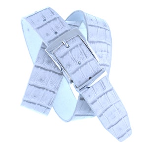 May include: A white leather belt with a silver buckle. The belt has a crocodile pattern.