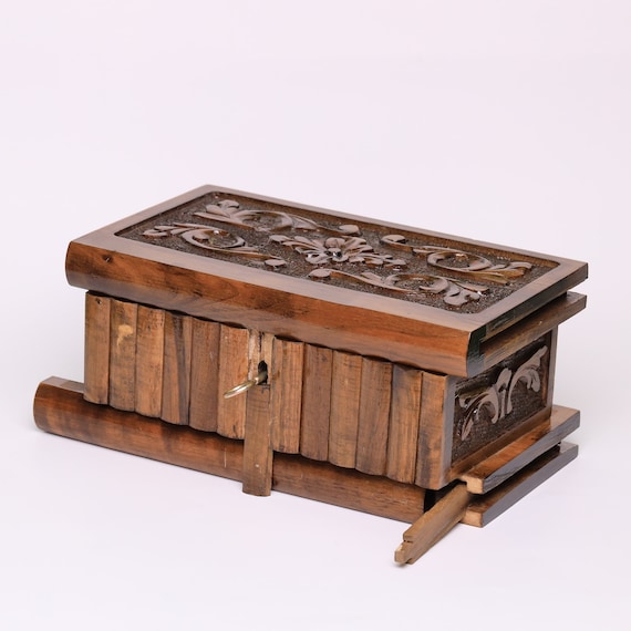 746 favorites don't lie — this hand-carved walnut custom secret-lock puzzle box with a hidden key is a masterclass in functional artisan craft, and the personalization option pushes it into perfect-gift territory.