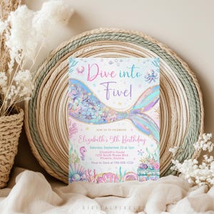 May include: A rectangular birthday invitation card featuring a mermaid tail illustration with iridescent scales, surrounded by sea creatures and coral. The text reads Dive into Five! Join us to celebrate Elizabeth's 5th Birthday, Saturday, September 23 at 1pm, Elizabeth's House, 1234 South Roxas Blvd, Phoenix, Arizona, Rsvp to Sara at 789-456-1230.
