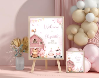 May include: A pink and white farm-themed birthday party sign with the text "Welcome to Elizabeth's 3rd Birthday." The sign features illustrations of farm animals and a barn. A smaller matching sign is also present.