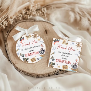 May include: Two pirate-themed gift tags with white ribbon. One is round, the other rectangular. Both feature pirate ship illustrations, cannons, and the text "Thank You for celebrating with me, Love, Sebastian."