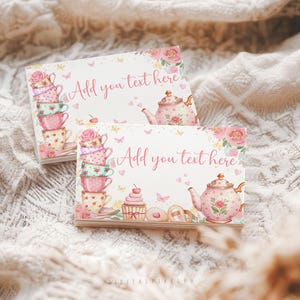 May include: Two rectangular cards with watercolor illustrations. One card features a stack of teacups, the other a teapot. Both cards have the text "Add you text here" and are decorated with floral and butterfly motifs.