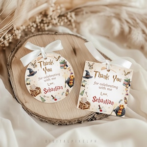 May include: Two decorative gift tags with white ribbon. The tags feature a beige background with illustrations of a wizard theme. The text on the tags reads "Thank You for celebrating with me, Love, Sebastian."