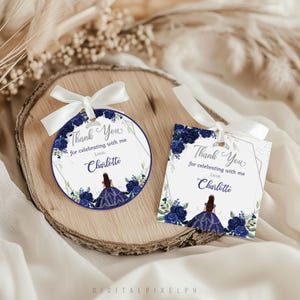May include: Two gift tags with white ribbon. One is round, the other is square. Both feature a navy blue floral design and the text "Thank You for celebrating with me, Love, Charlotte". A princess illustration is also included.