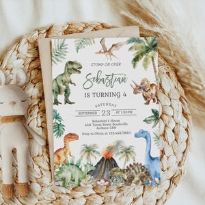 May include: A rectangular birthday invitation card featuring watercolor illustrations of various dinosaurs, palm trees, and a volcano. The text reads: STOMP ON OVER Sebastian IS TURNING 4 SATURDAY SEPTEMBER 23 AT 1:30PM Sebastian's House 456 Tunas Street Southville Jackson 589 Rsvp to Olivia at 123.456.7890.