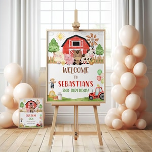 Könnte beinhalten: Ein gerahmtes Schild auf einer Staffelei mit Bauernhof-Motiv, das eine rote Scheune, eine Windmühle und Zeichentricktiere zeigt. Auf dem Schild steht "Welcome to Sebastian's 2nd Birthday". Ballons und ein kleineres passendes Schild sind ebenfalls vorhanden.