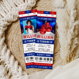 May include: Two rectangular birthday invitation tickets with a boxing theme, featuring red, white, and blue colors. The tickets display the text IT'S GAME TIME, WILLIAM IS TURNING 10, and include details for a party at Peterson's Field on September 12, 2021.