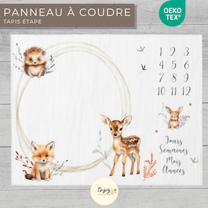 May include: A white growth chart with a brown wooden frame. The chart features a circle with a white background and a brown border. The circle is surrounded by illustrations of a hedgehog, a fox, a deer, and a rabbit. The chart also includes numbers 1 through 12 and the words "Days, Weeks, Months, Years".