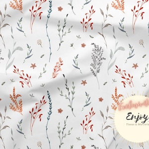 May include: A white fabric with a repeating pattern of watercolour-style floral sprigs in shades of blue, grey, and orange. The fabric has a subtle texture and a soft, flowing drape.